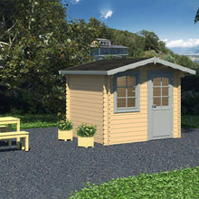 Load image into Gallery viewer, Beige Color DIY Cabin Kit 8x7 Fenway, One Door And One Window and Black Shingle Roof, Assembled in the Backyard, By the Trees by WholeWoodCabins.
